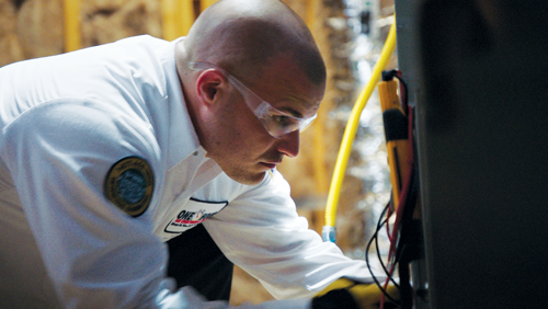 Furnace repair in Clearwater, FL with technician working on equipment.