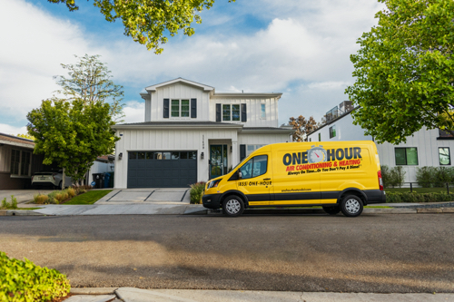 Mini-split Ductless System Services in Clearwater, FL, service truck in front of residential home ready to provide services.