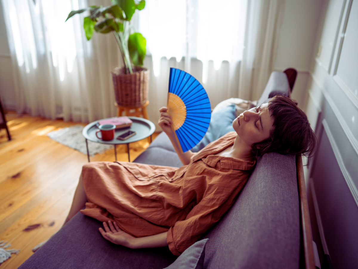 Woman feeling effects of stuffy Clearwater home