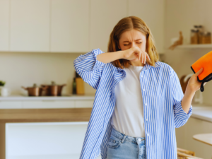 Woman feeling sick due to poor indoor air quality